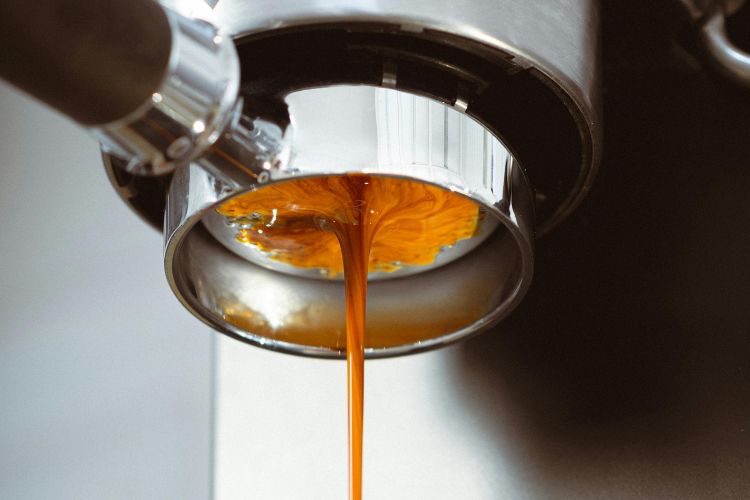 Close-up of Fresh Espresso Brewing in Coffee Machine