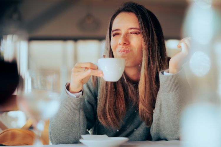 Displeased Woman Disliking Coffee for Burnt Taste