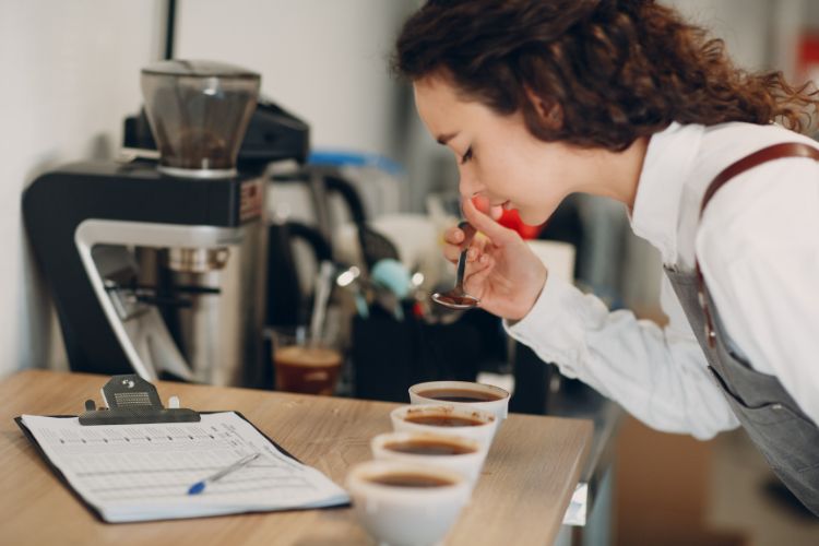 Barista tasting different coffee samples