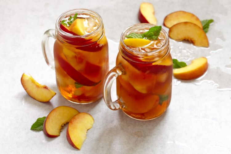 Peach iced oolong tea with peach slices
