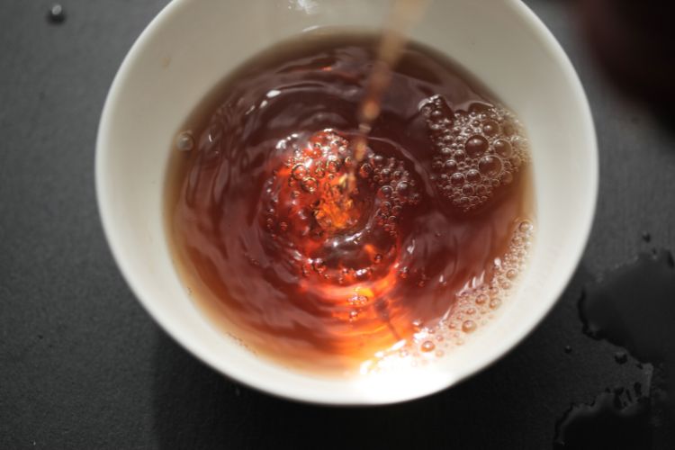 Pu Erh Tea being poured into cup