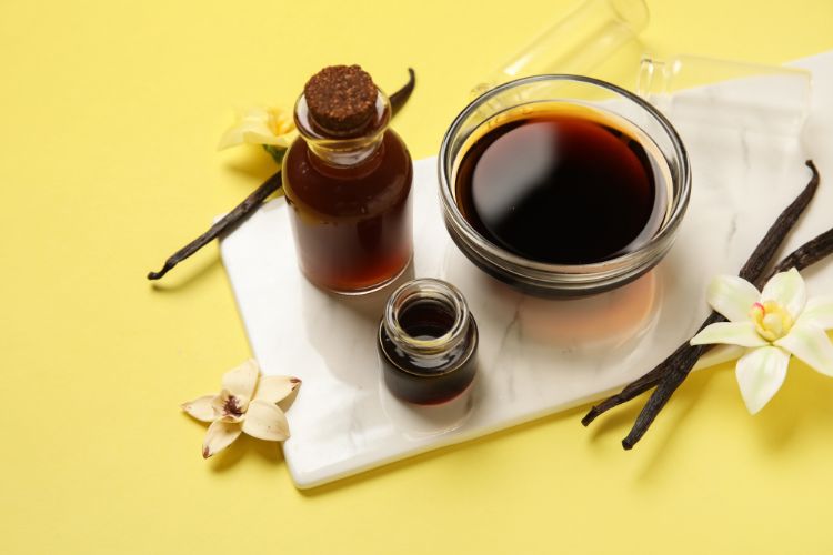 Vanilla Extract in Bottles, Vanilla Pods and Flowers