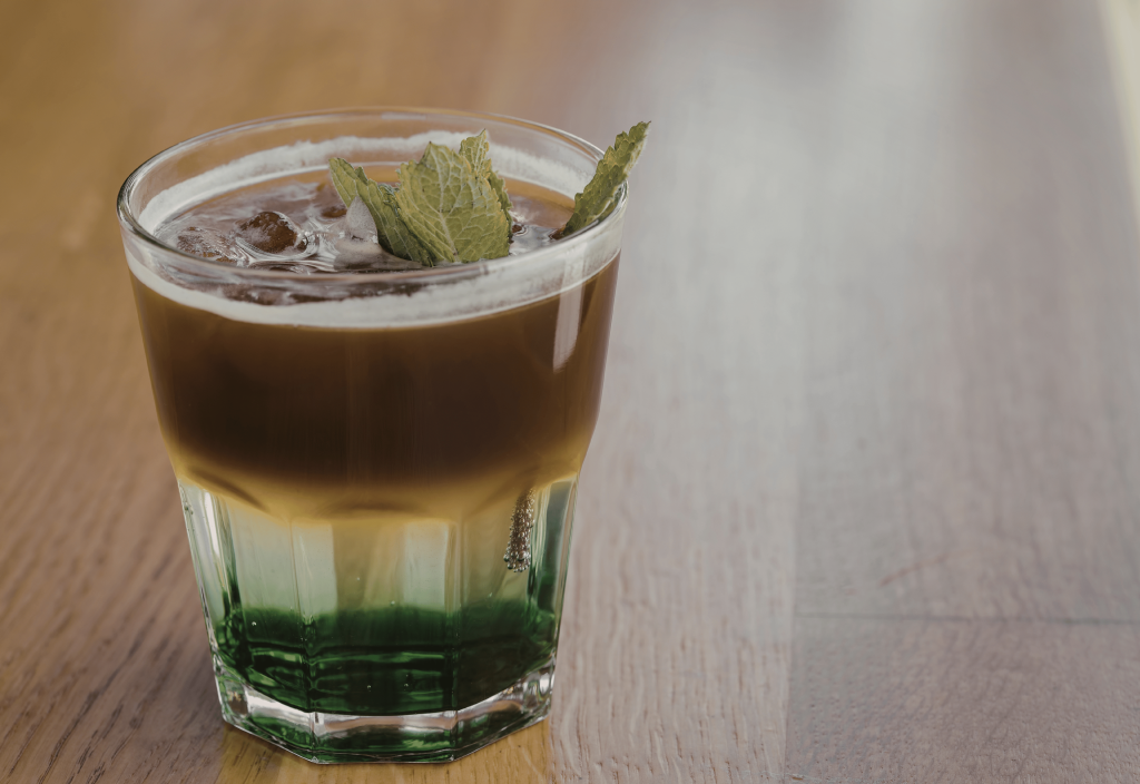 Glass full of iced mint latte