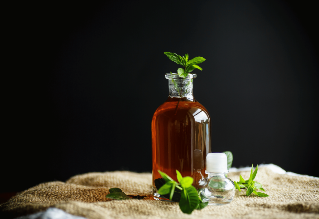 mint syrup in a glass bottle