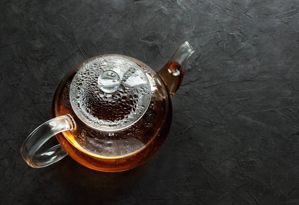 glass teapot full of tea viewed from above